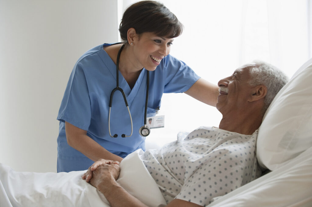 Nurse with elderly male patient